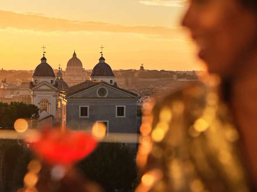 Girl having a drink and city view on background