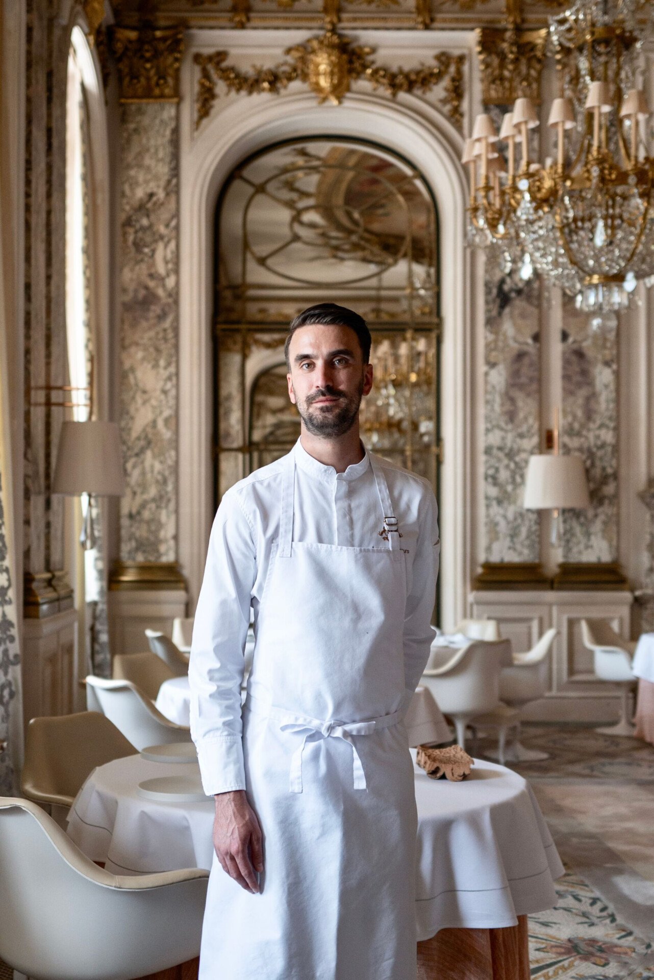You can observe chef Amaury Bouhours, standing in the middle of Le Meurice Alain Ducasse Restaurant, at Le Meurice, Paris. 