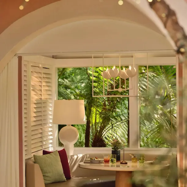 Alcove booth dinner moment in The Restaurant at Hotel Bel-Air