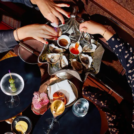 Woman looking out window of Park Lane Studio