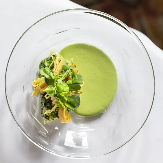 Saint Pierre fish fillet with watercress butter and artichokes at Restaurant Le Meurice Alain Ducasse, at Le Meurice, Paris.