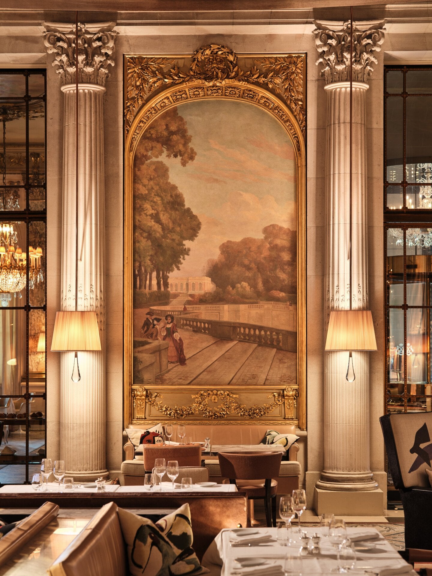 Focus on a painting overhead a table and between two lamps in the restaurant Le Dali, at Le Meurice, Paris