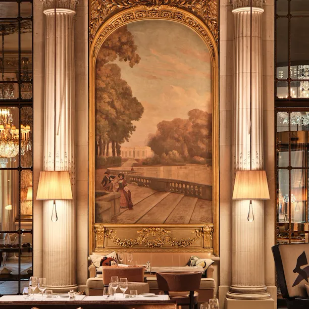 Focus on a painting overhead a table and between two lamps in the restaurant Le Dali, at Le Meurice, Paris
