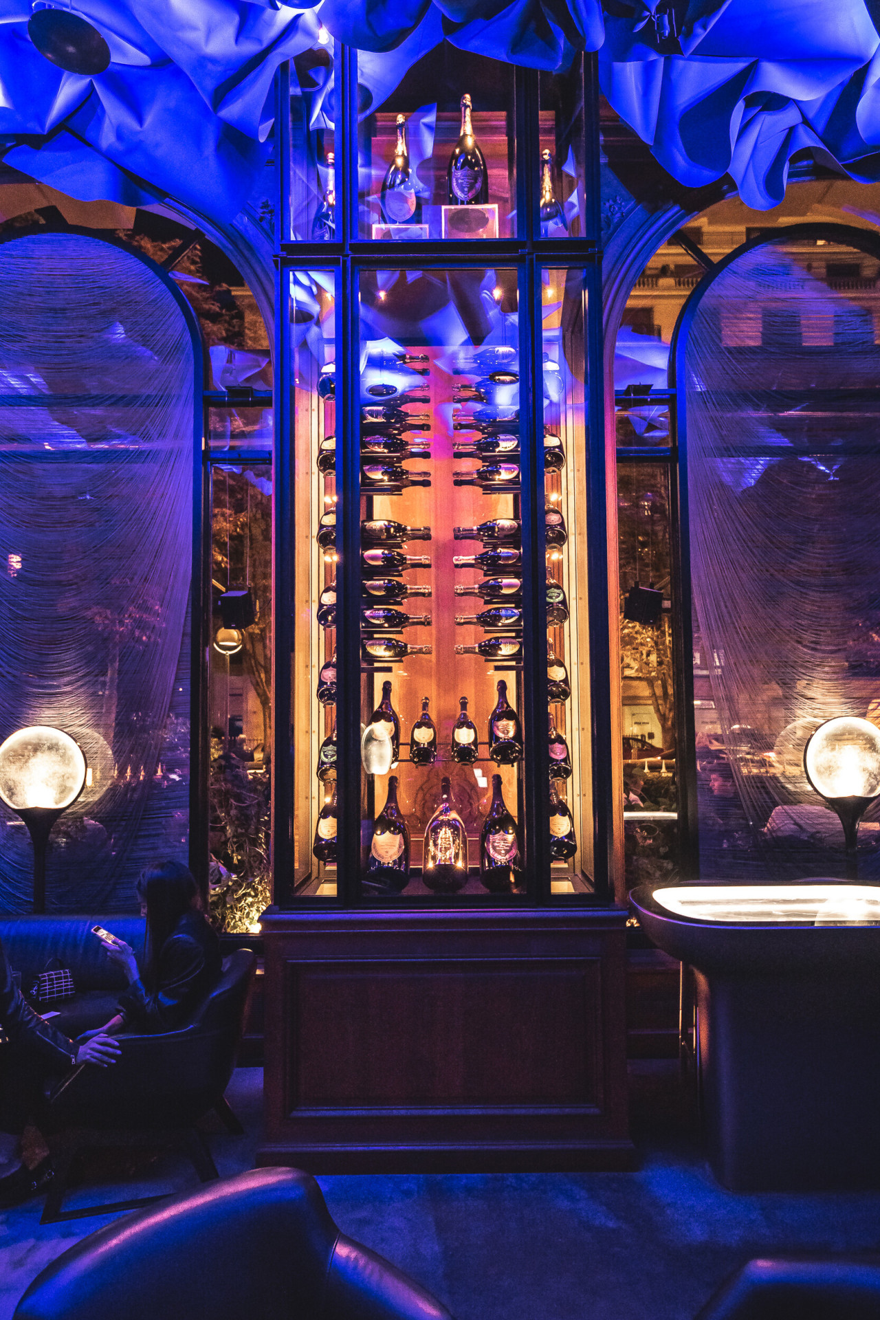 Le Bar's unique Dom Pérignon Cellar illuminated and the draped ceiling, at Hotel Plaza Athénée, Paris
